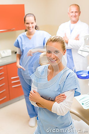 Female dentist with colleagues Stock Photo