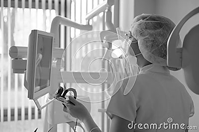 A female dentist examines the patient`s jaw pictures Stock Photo