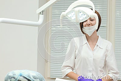 Female dentist near her workplace waiting for patients Stock Photo