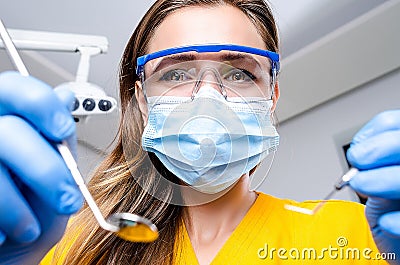 Female Dentist With Tools Stock Photo