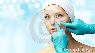 Female derma rejuvenate treatment. Doctor in gloves touch woman face. Cosmetology pretty portrait. Facial nosr injection patient Stock Photo