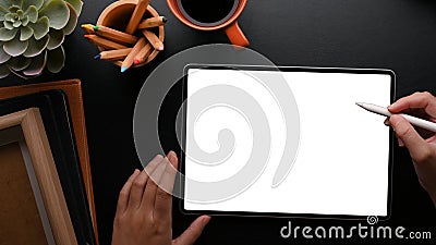 Female designer sketching clothes design on graphic tablet in modern workspace Stock Photo