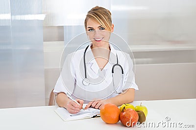 Female Dietician In Clinic Stock Photo