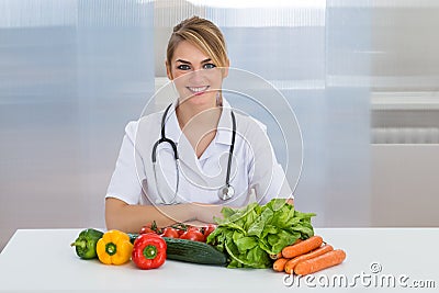 Female dietician with vegetables Stock Photo