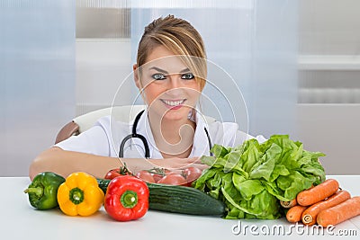 Female dietician with vegetables Stock Photo