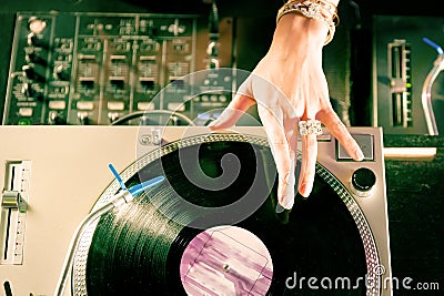 Female DJ at the turntable in Club Stock Photo