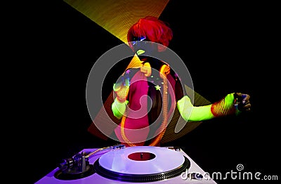 Female djing in glow UV costume Stock Photo