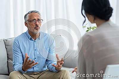 Female doctor consulting a man Stock Photo