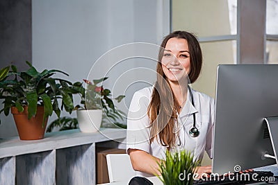 Female doctor giving medical prescriptions by internet. Stock Photo