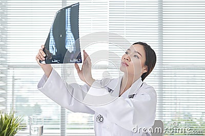 Female doctor is examined x-ray film Stock Photo