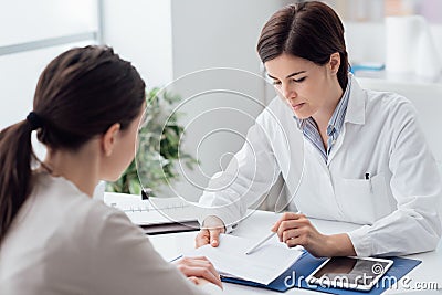 Doctor explaining diagnosis to the patient Stock Photo