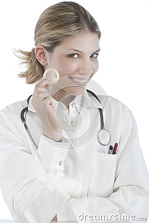 Female Doctor holding condoms Stock Photo