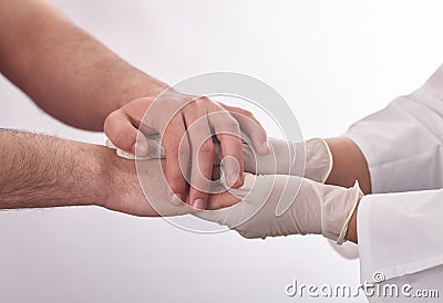 Female doctor holding patients hand. Stock Photo