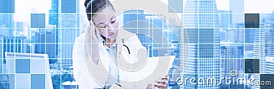 Female doctor with laptop reading medical report Stock Photo