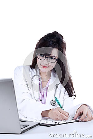 Female doctor making presciption isolated Stock Photo