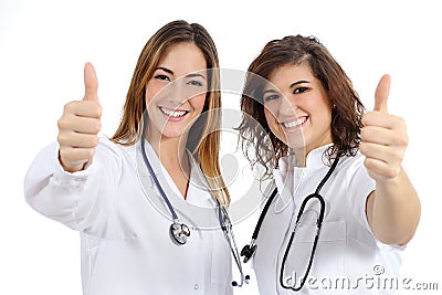 Female doctor and nurse with thumb up Stock Photo