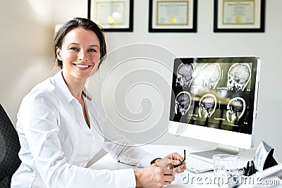 Female Doctor in Office Stock Photo