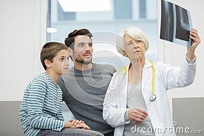 female doctor pediatrist and boy looking at xray Stock Photo