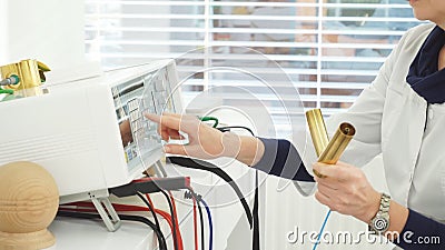 Female doctor pushing buttons of medical device. Female doctor push buttons on medical equipment while patient lying on bed stock video Female doctor pushing buttons of medical device. Female doctor push buttons on medical equipment while patient lying on bed stock video