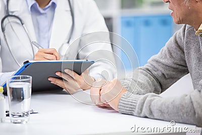 Female doctor see elder patient Stock Photo