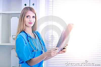 Female doctor showing x-ray at hospital Stock Photo