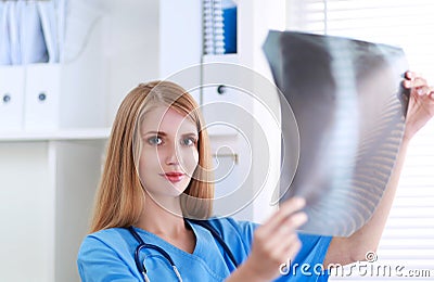 Female doctor showing x-ray at hospital Stock Photo