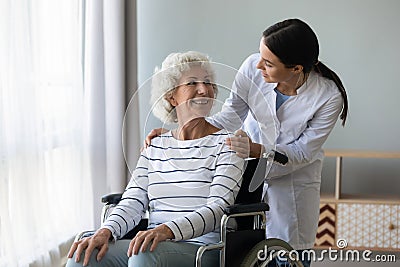 Female doctor take care of disabled senior lady Stock Photo