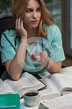 Female doctor taking drugs Stock Photo