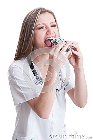 Female doctor taking a lot of blisters of pills Stock Photo
