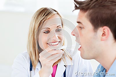 Female doctor taking a saliva sample Stock Photo