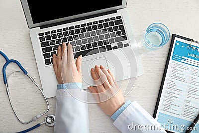 Female doctor using computer at workplace. Health care concept Stock Photo