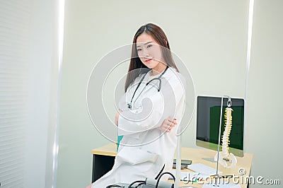 Female doctor working at office desk, healthcare professionals Stock Photo