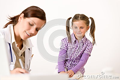 Female doctor write prescription for child Stock Photo