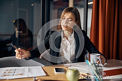 Female drafter sitting at the office desk Stock Photo