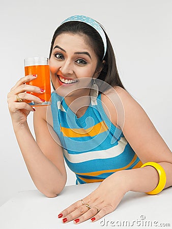 Female drinking orange juice Stock Photo