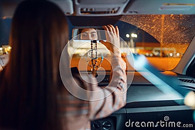 Female driver at the night, car burglar risk Stock Photo