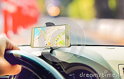 Female driver sitting in the car use mobile smart phone with map gps navigation application Stock Photo