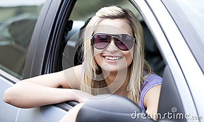 Female driver wearing sunglasses Stock Photo