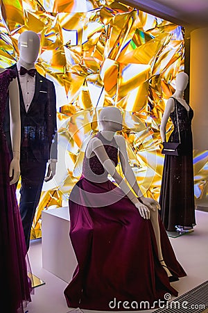 Female dummies in stylish and fashionable clothes in a show-window of shop. New collection. Editorial Stock Photo