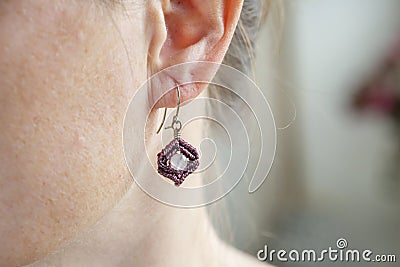 tiny elegant metal wire stone bead earring Stock Photo