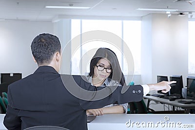 Female employee expelled by her manager Stock Photo