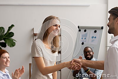 Young employee getting promotion handshaking with boss owner executive manager Stock Photo