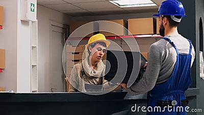 Female employee scanning barcodes on goods Stock Photo