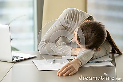 Female employee slumbers at workplace in office Stock Photo