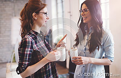 Colleagues having coffee break in modern office Stock Photo