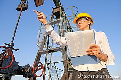 Female engineer in oil field Stock Photo