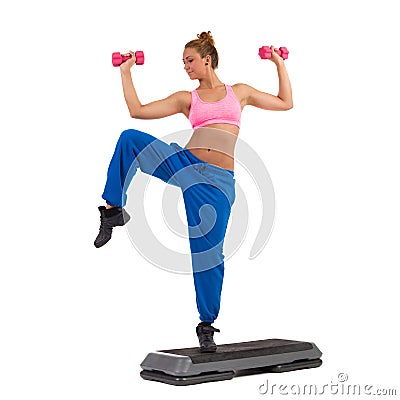Female Exercise On Aerobic Step With Hand Weights Stock Photo