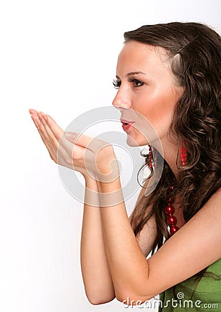 Female expressing kindness by blowing kisses Stock Photo