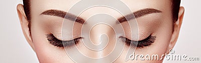 Female eye with long false eyelashes Stock Photo