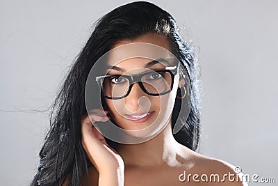 Female Eye wear. Attractive Brunette Girl in Transparent Glasses. Stock Photo